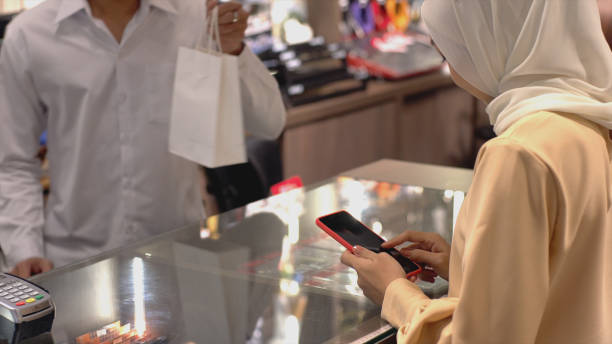 istock Asian Muslim Woman Using Contactless Payment 1219850290