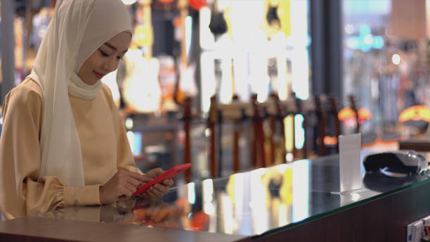 istock Asian Muslim Woman Using Contactless Payment 1219850356