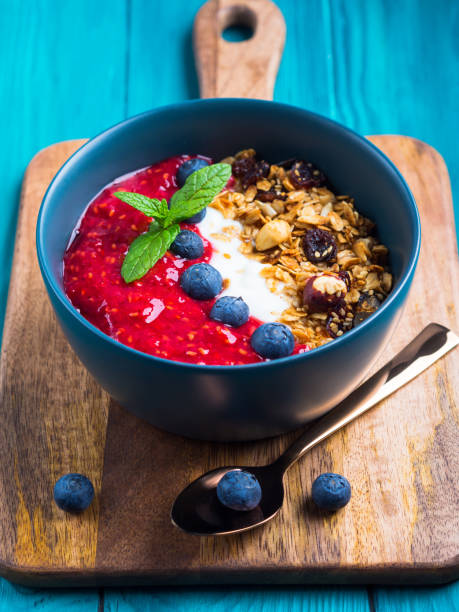 istock Yogurt smoothie bowl with blended raspberries 1219851978