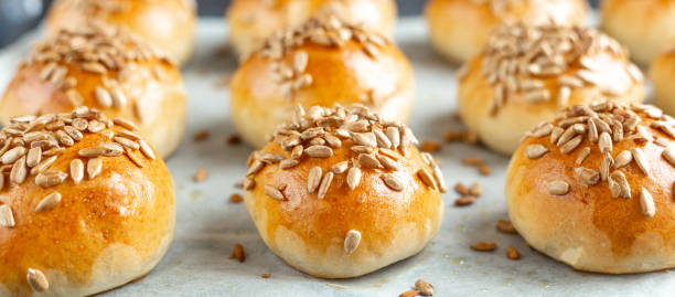 istock Hot fresh homemade buns sprinkled with seeds. Close-up, selective focus 1219852961