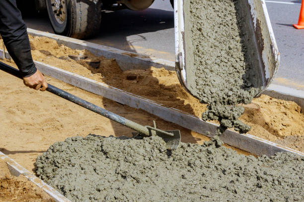 istock Concrete being poured from a truck into a concrete with sidewalk 1219853297