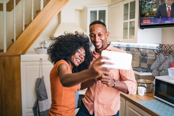 istock Couple at home doing teleconferencing while stay at home during isolation 1219853367