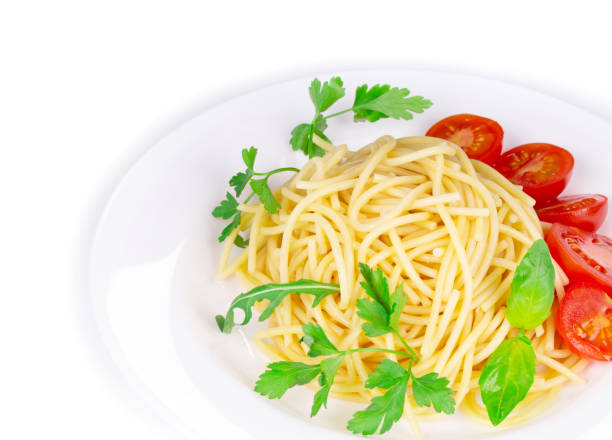 istock A fragment of a dish with pasta and tomatoes with basil. 1219853390