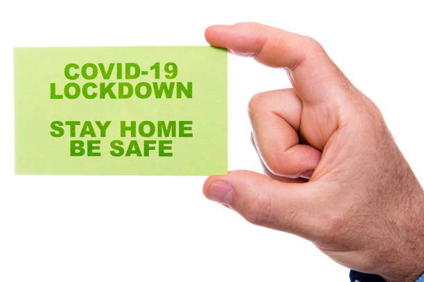 istock man holding a business card 1219855001