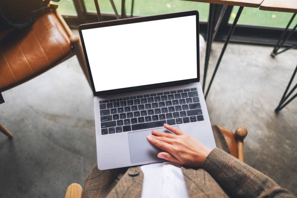 istock a woman using and touching on laptop computer touchpad with blank white desktop screen 1219855241