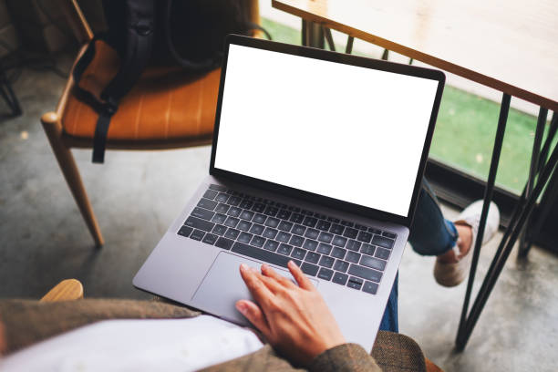 istock a woman using and touching on laptop computer touchpad with blank white desktop screen 1219855257
