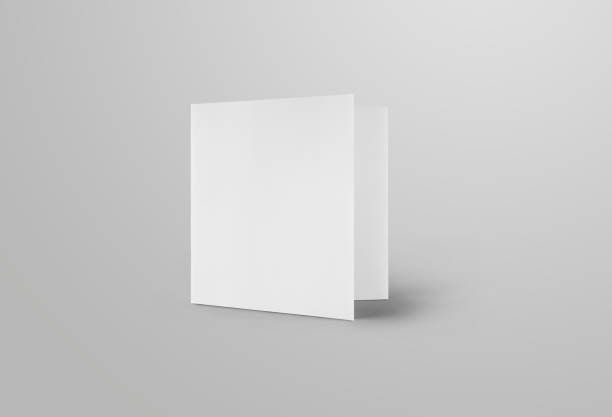 Mockup of a white blank trifold, front view, standard standing roll fold brochure, isolated on background.