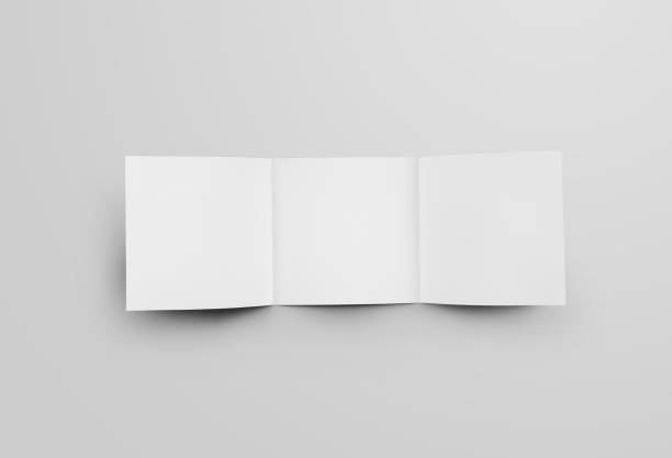 istock Mockup of standard square booklet, open white leaflet, isolated on background, inside view. 1219857614