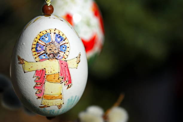 Bavaria, Germany. Easter customs - Hand painted egg and Catkins (Salix caprea) as background.