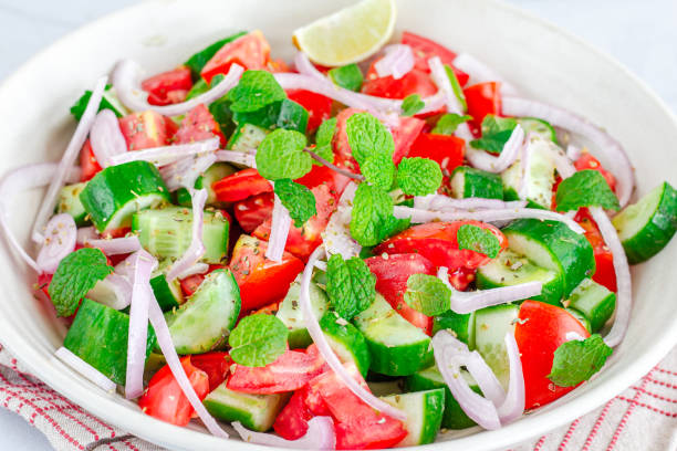 istock Close-Up Tomato Cucumber Salad in a Bowl 1219860787