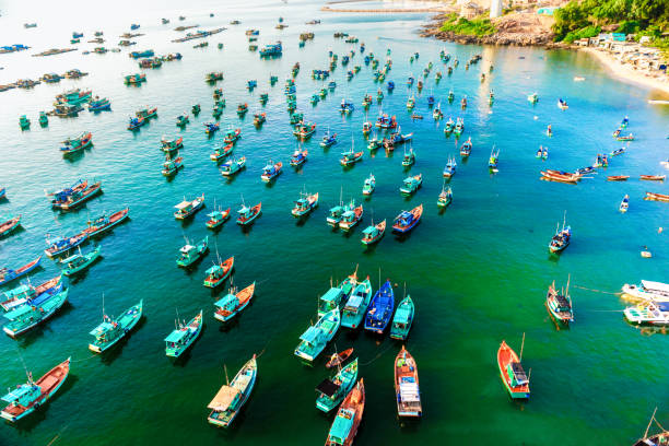 many multi-colored, beautiful ships in the sea. view from above many multi-colored, beautiful boats in the sea. there are many floating boats in turquoise water, panoramic shots from the air. meeru island stock pictures, royalty-free photos & images