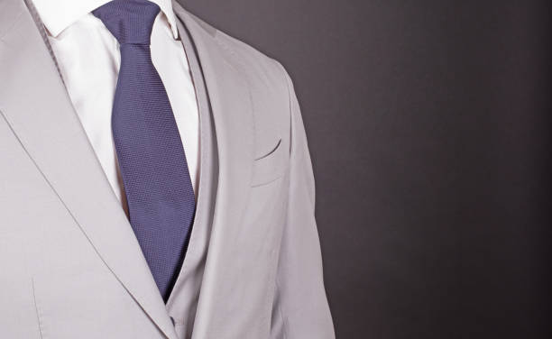 istock Man in a grey suit with blue tie, close-up 1219862188