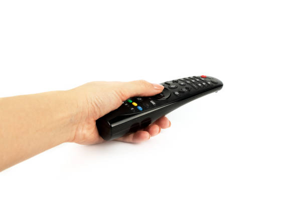 istock black remote control in hand isolated on white background 1219863326