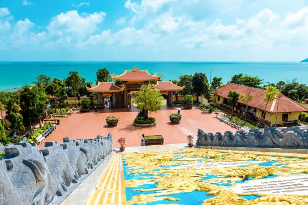 sunny day, a large beautiful temple in Vietnam, Phu Quoc island. many statues and beautiful temples.