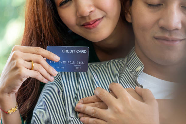 istock Young happy Asian couple having good time while stay at home 1219864208