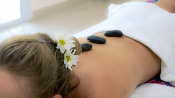 istock Young woman having massage at luxury spa. 1219864320
