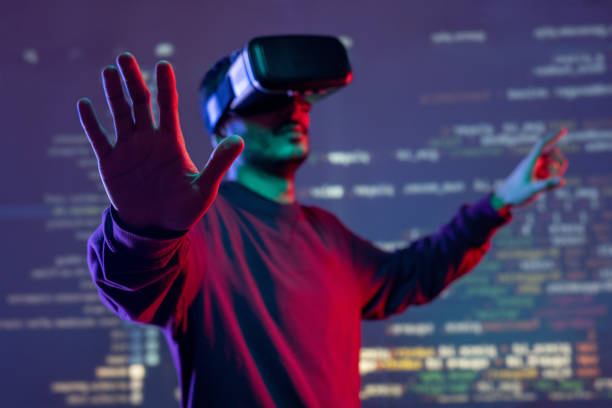 Analyzing programming code in VR goggles Young man gesturing hands while analyzing programming code in virtual reality goggles virtual reality point of view photos stock pictures, royalty-free photos & images