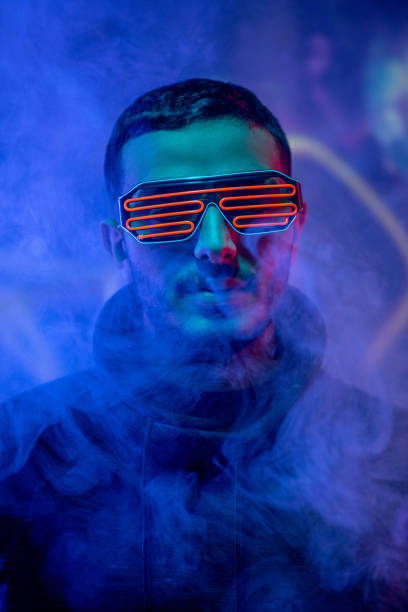 istock Young man in smoked dark room 1219865442
