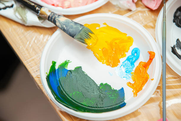 Brushes and colorful abstract oil paints on a pallet