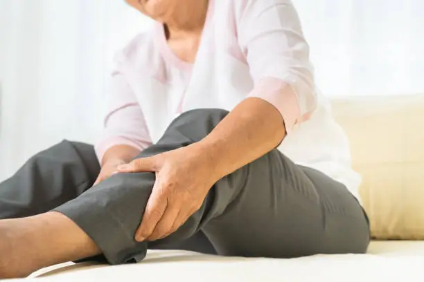 leg pain of senior woman at home, healthcare problem of senior concept