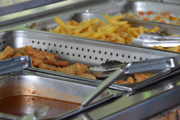 istock Grave, vegetables and fried potatoes on self-service buffet 1219871397