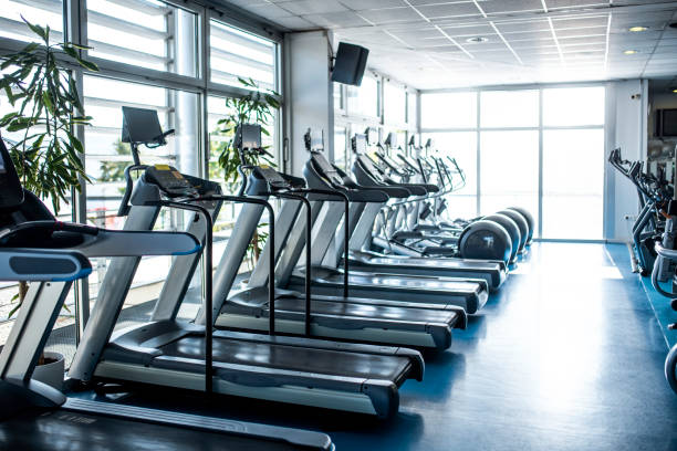 istock Side View of Treadmills at Modern Gym 1219871460