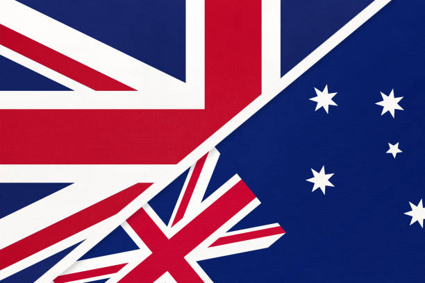 istock United Kingdom vs Australia national flag from textile. Relationship between two European and Oceania countries. 1219872158