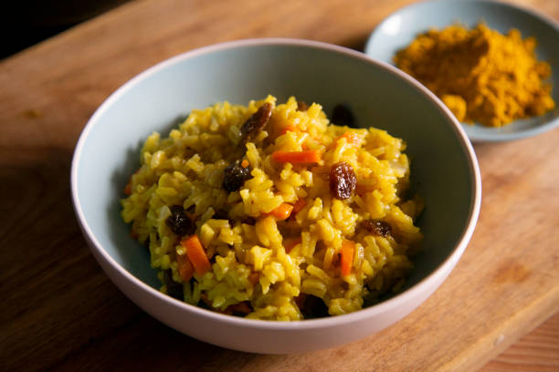 istock Yellow curry rice with vegetables and raisins 1219873702