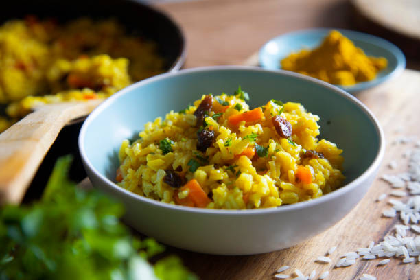 istock Yellow curry rice with vegetables and raisins 1219873706