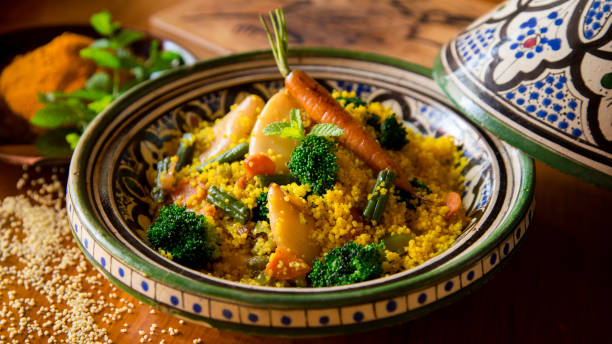 Tagine Cuscus with Calamari and vegetables Tagine Cuscus with Calamari and vegetables couscous stock pictures, royalty-free photos & images