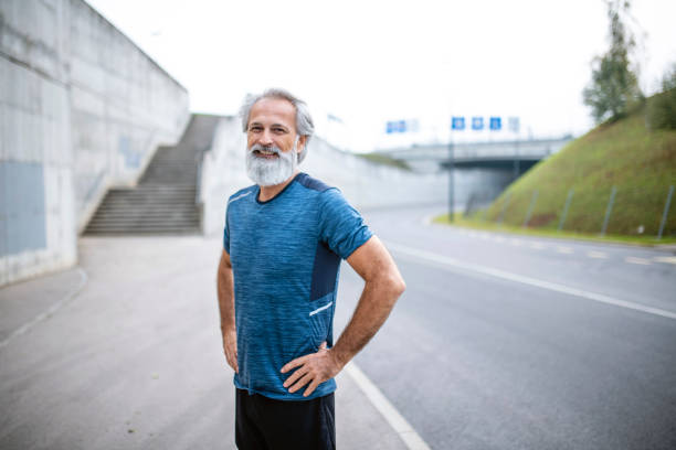 istock Fit Bearded Caucasian Man in Mid 50s With Hands on Hips 1219875390