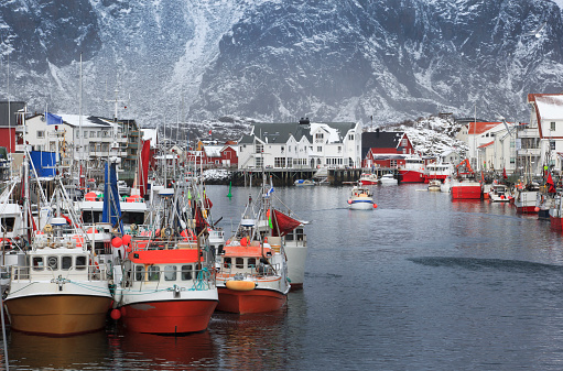 Fishing boats in the harbour of Henningsvaer a fishing village in the Lofoten archipelago, Norway.