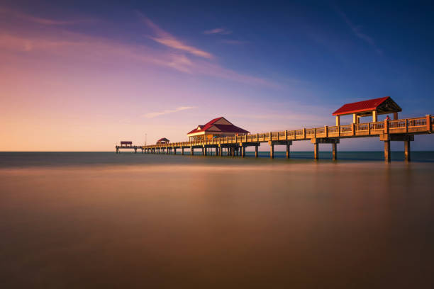 Pier 60 at sunset on a Clearwater Beach in Florida Pier 60 at sunset on a Clearwater Beach in Florida. Long exposure. clearwater florida photos stock pictures, royalty-free photos & images