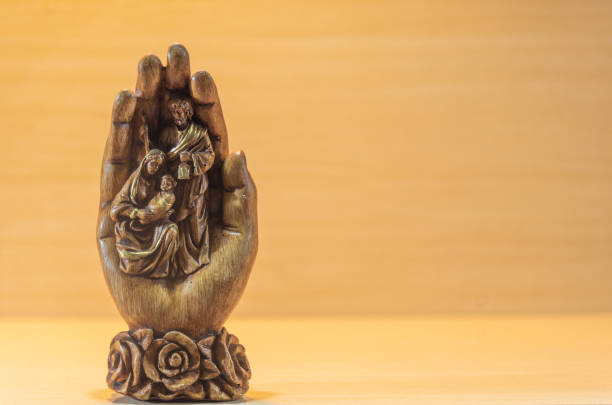 Image of the holy family. Baby Jesus Christ in the lap of Mary and Joseph. Symbol of Catholicism. Religious artifacts symbolizing Christianity. Image of newborn Christ.