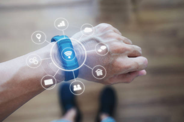 istock Smart watch and smart gadget technology. a man wearing futuristic smart watch 1219876581