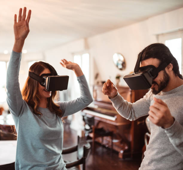 istock family at home using VR headset 1219877947