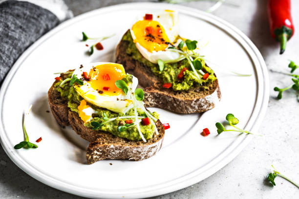 istock Spinach Hummus with Soft Boiled Egg on Sourdough Rye Bread 1219879511
