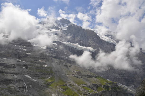 istock The Jungfrau massif is surrounded by clouds 1219881642