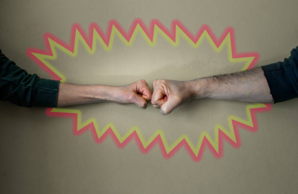istock Close up of fists collide within a drawn shape with bright colors. 1219883476