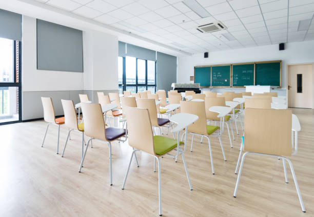 istock Empty classroom with desks and chairs for music lessons 1219884926