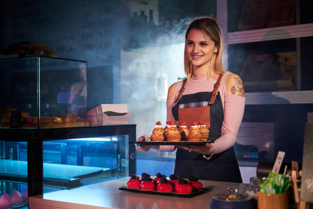 istock Woman is working with cakes at bakery shop 1219885934