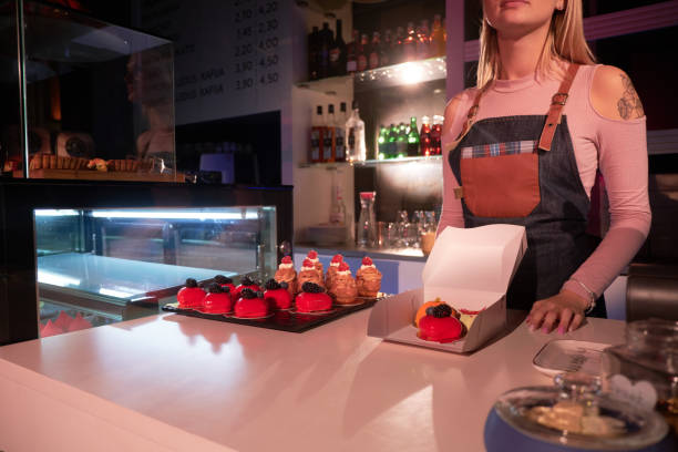 istock Woman is working with cakes at bakery shop 1219886314