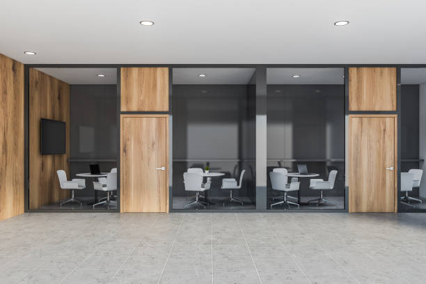 istock Gray and wooden coworking office interior 1219887308