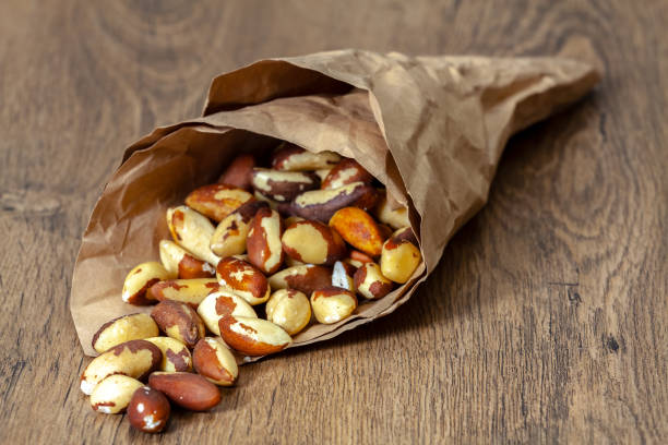 istock Brazil nut in paper bag 1219888266