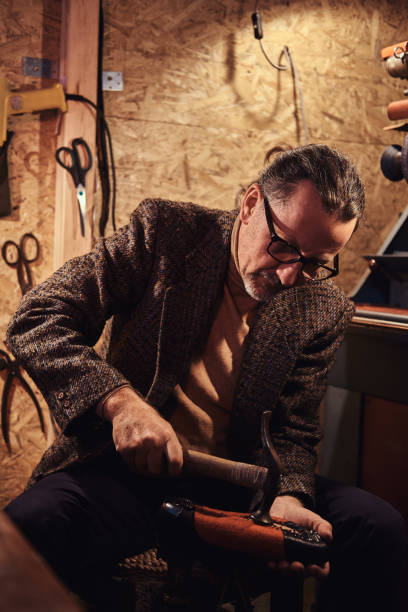 istock Busy man at his own workshop 1219889346