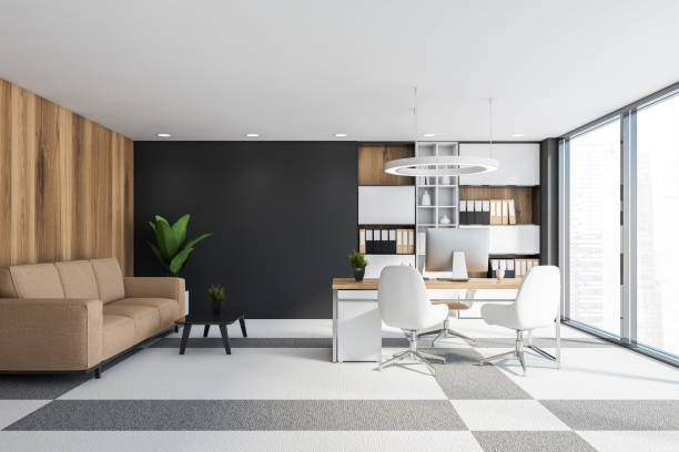 istock Wooden and gray CEO office interior with sofa 1219889454