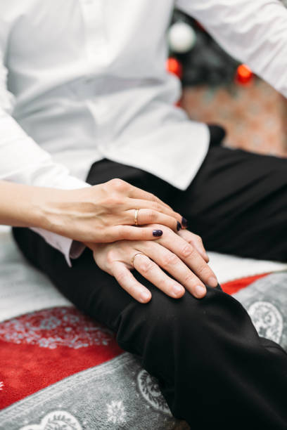 istock Hands with rings of newlyweds 1219889998