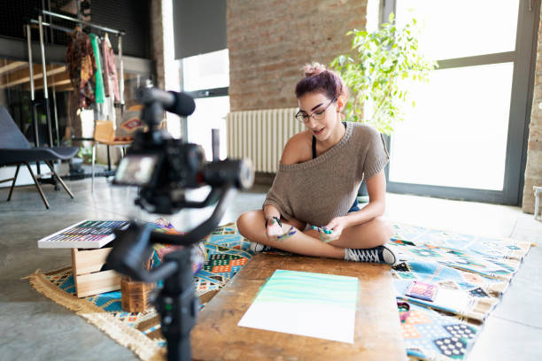 istock Young woman filming a vlog about drawing 1219890304