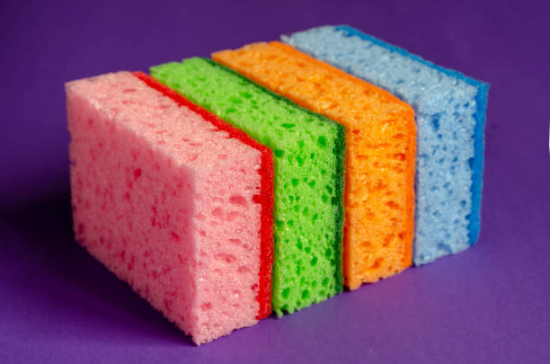 istock Kitchen sponges on a lilac background. 1219890455