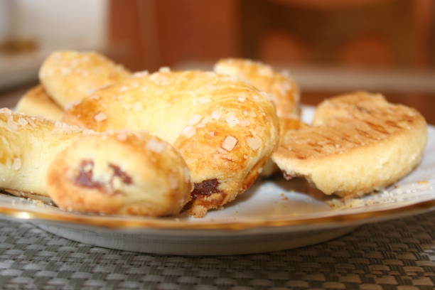 istock Sweet croissant cookies on white plate. 1219891168